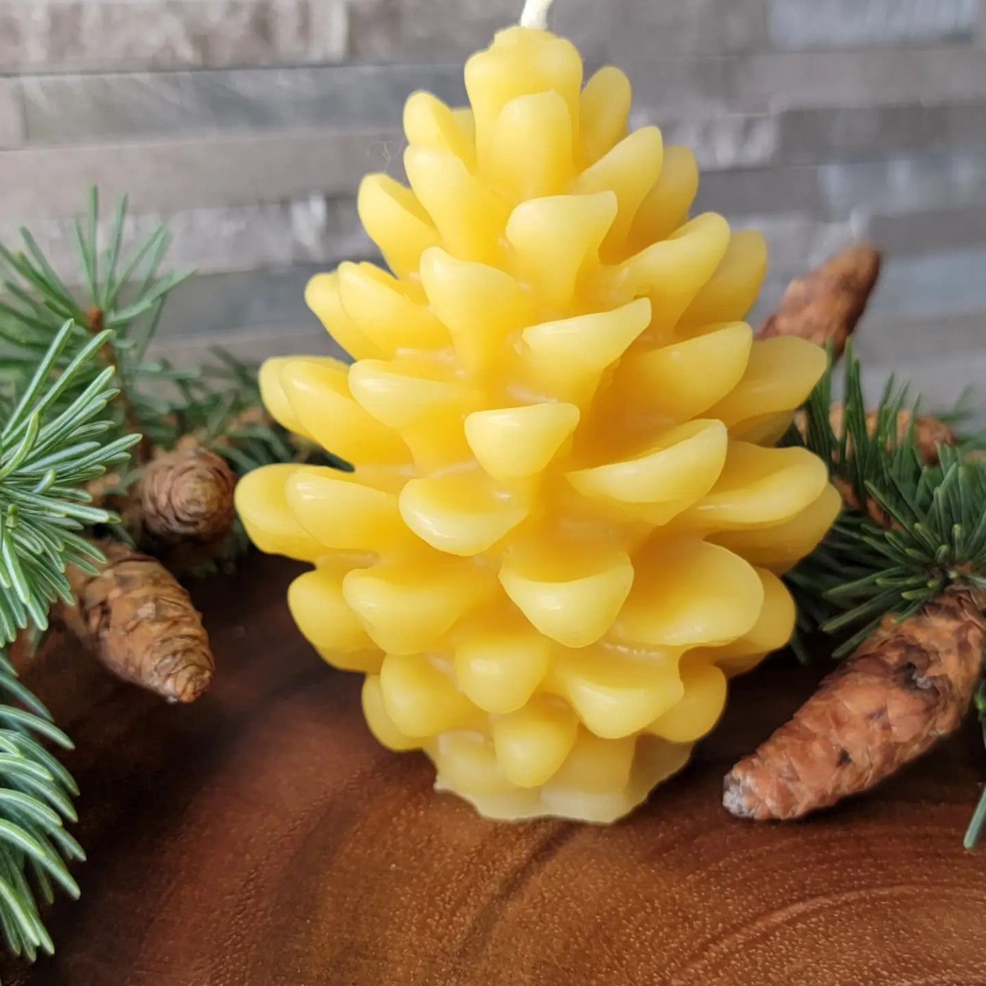 Pine cone shaped beeswax candle