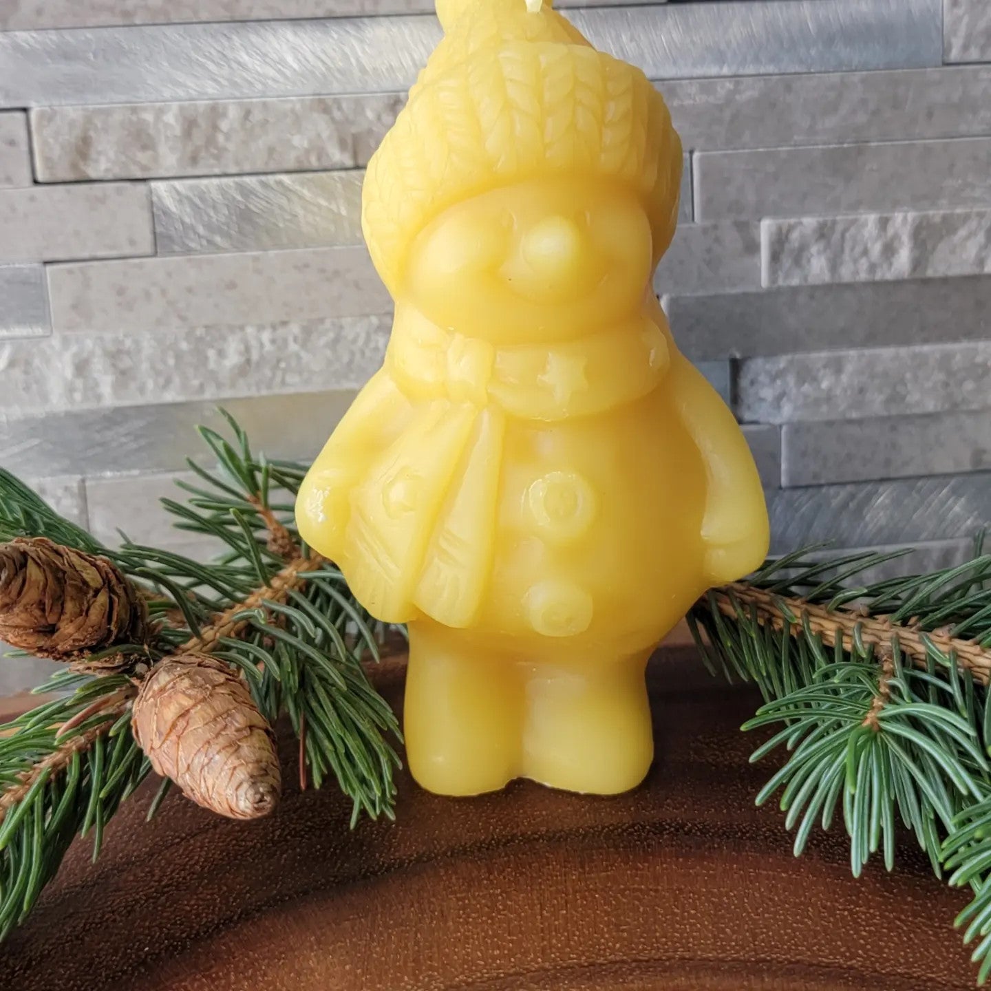 Snowman shaped beeswax candle
