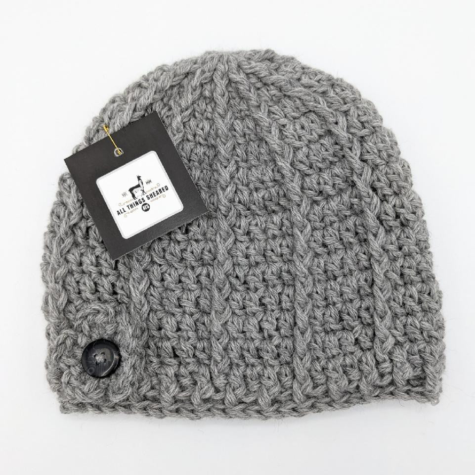 Handmade crocheted alpaca hat with flower button - natural