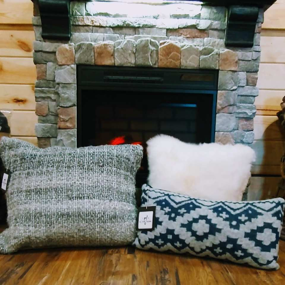3 pillows by a fire place